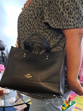 Coach Dempsey Carryall handbag, identified as a black pebble leather